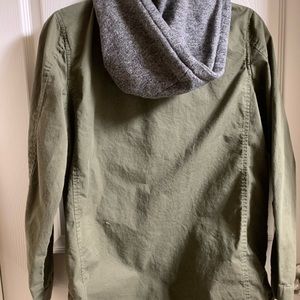 A cute unusual jacket type. The rose on the front is loose